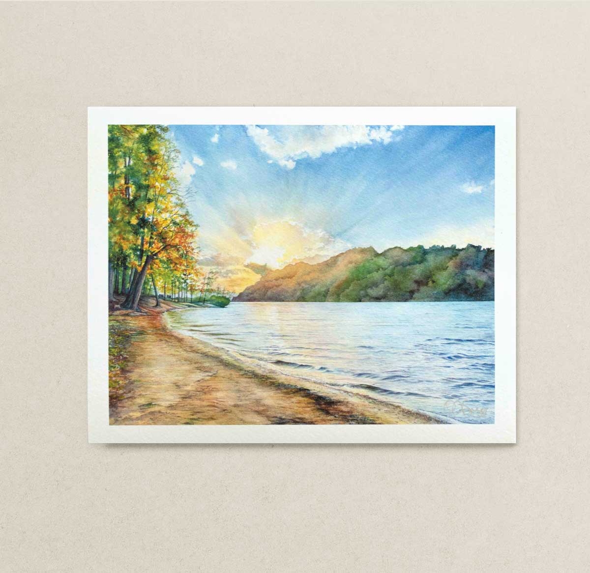 8" x 10" Art print of a watercolor landscape of Cheat Lake, WV with trees, water, and sky on a beige wall.