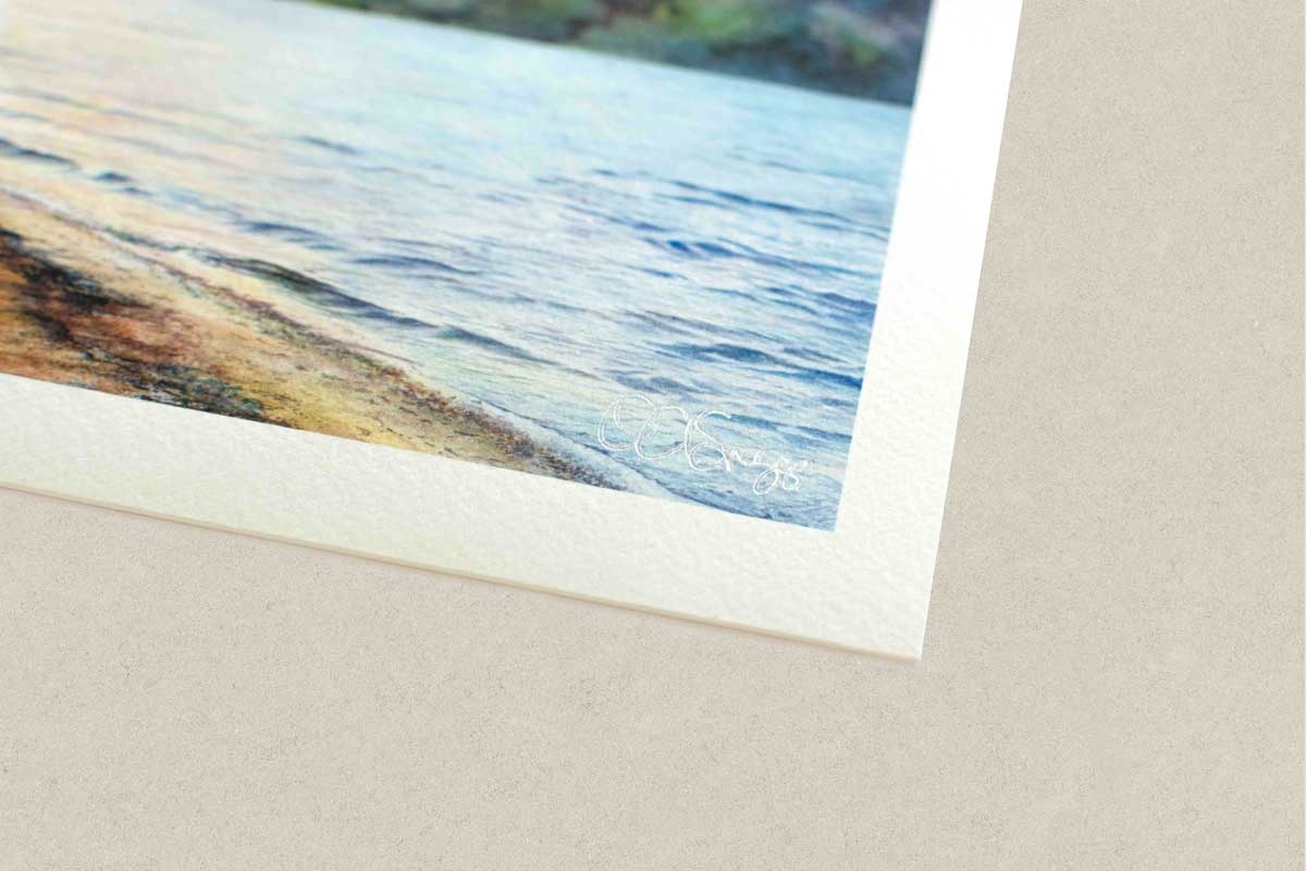 Close-up of a watercolor painting of a beach scene on textured paper.