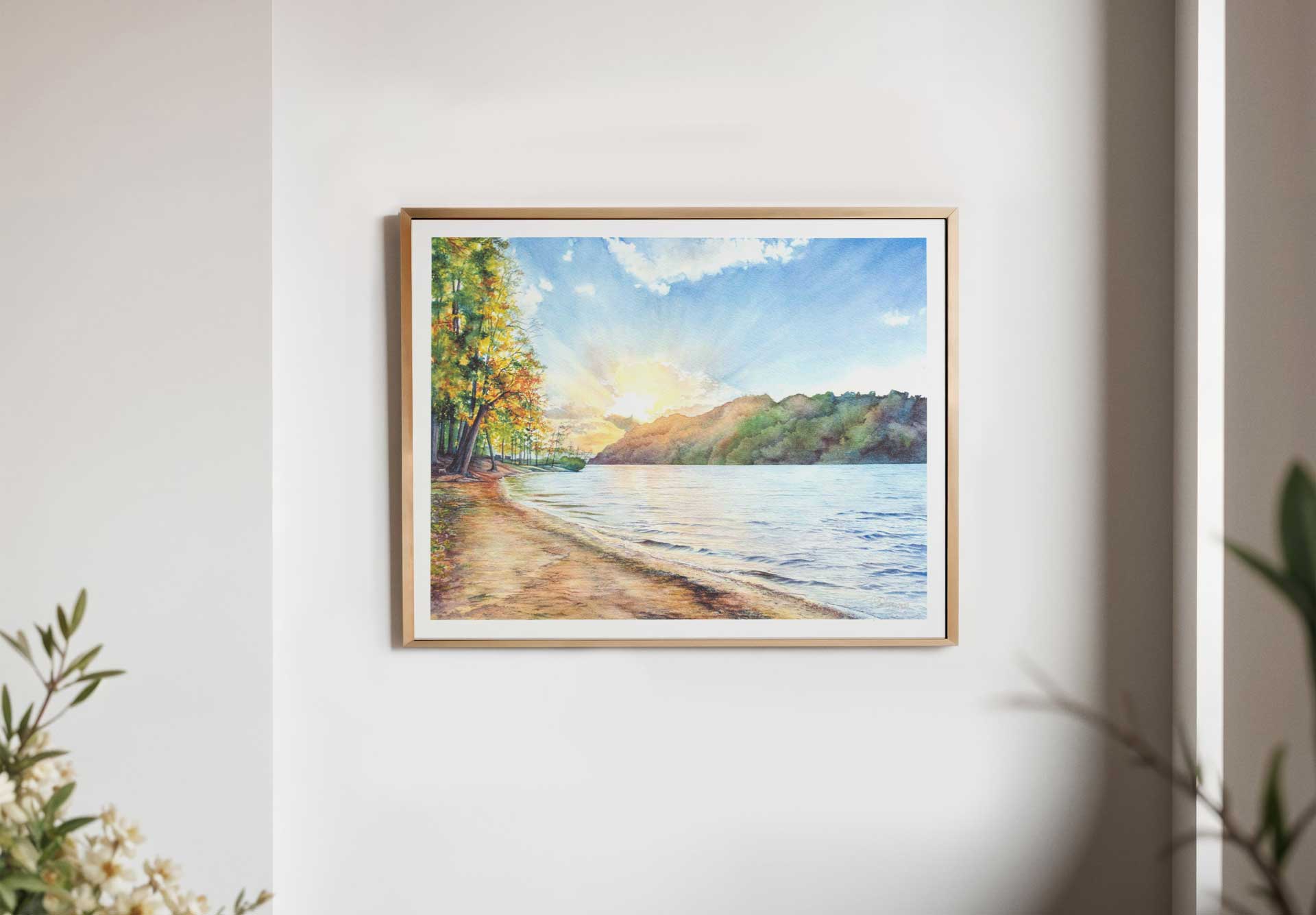 Example of a framed print of a landscape of Cheat Lake beach on a white wall.