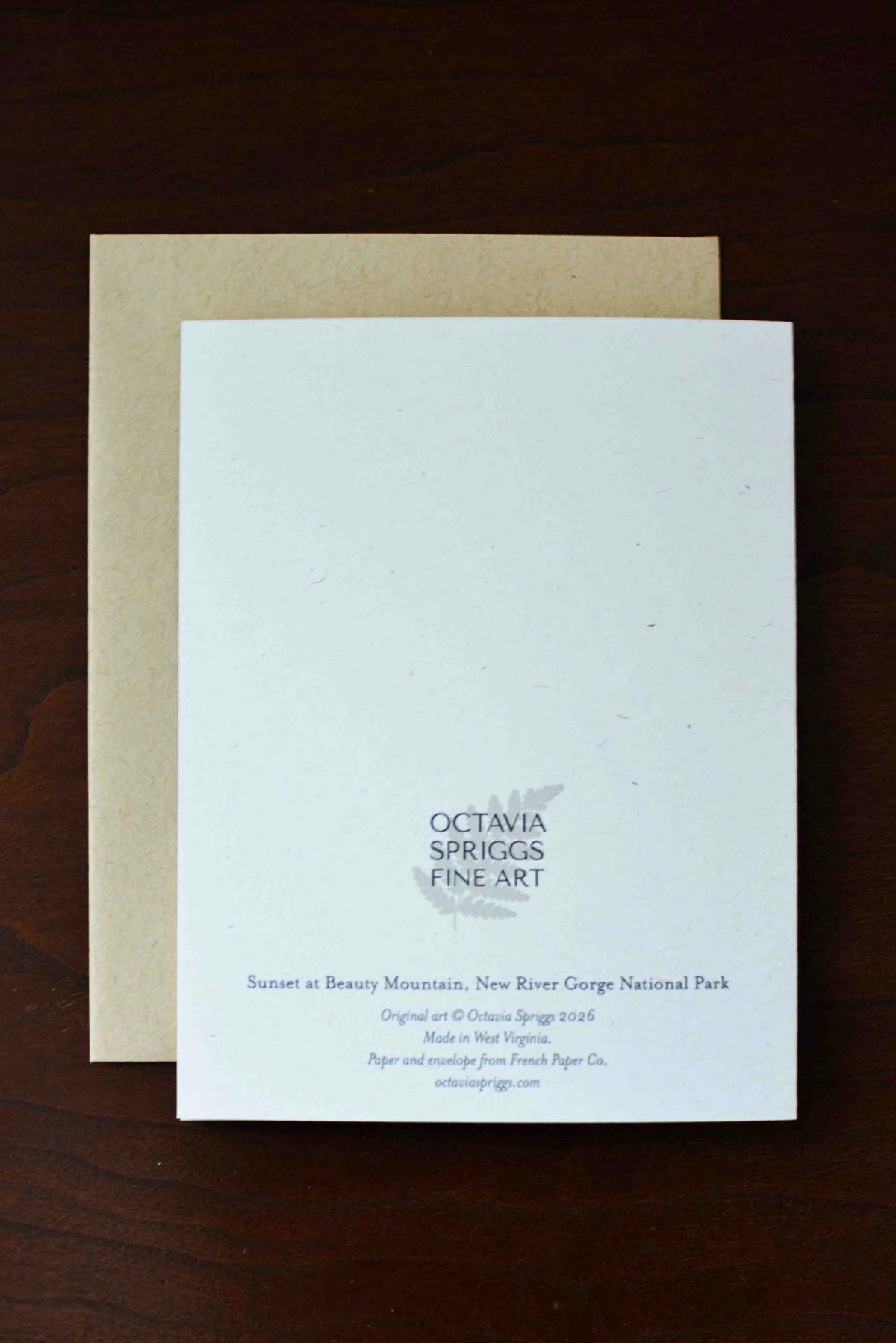 White backside of a notecard that reads "Sunset at Beauty Mountain, New River Gorge National Park" with the Octavia Spriggs Fine Art logo. 