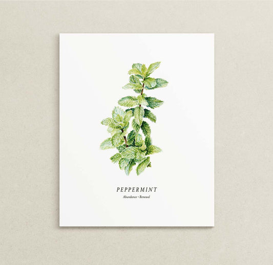 A vertical white art print featuring a watercolor illustration of a green peppermint plant stem with the text 'PEPPERMINT' and 'Abundance | Renewal' printed below, displayed against a neutral textured beige background.