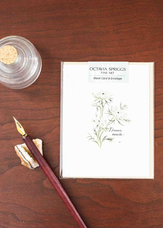Note Card with Queen Anne's Lace design and fountain pen on wooden surface